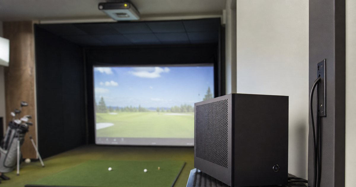 What computer specifications does a premium home golf simulator genuinely need to run smoothly?